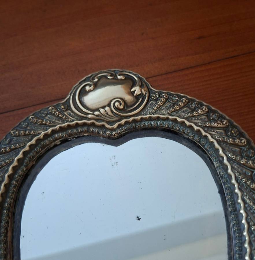 Ornate antique silver plate on brass heart shaped vanity dressing table mirror   14 x 19 cms