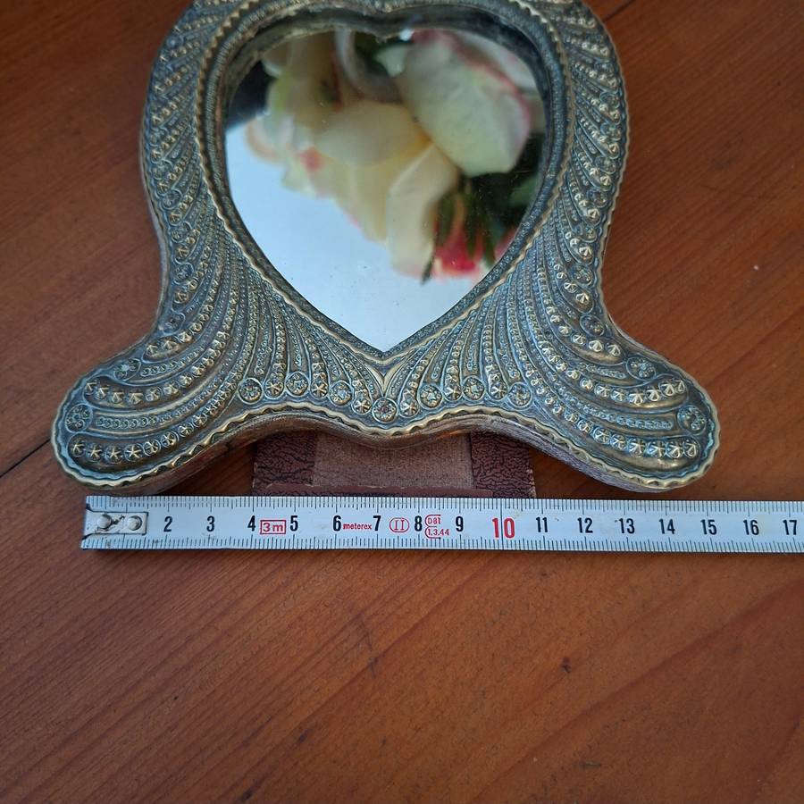 Ornate antique silver plate on brass heart shaped vanity dressing table mirror   14 x 19 cms