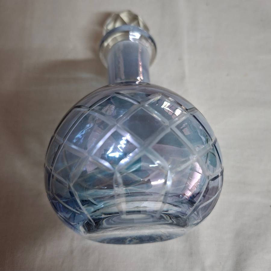 2 perfume bottles approx 16 cms tall - stamped gero. Cut crystal stoppers