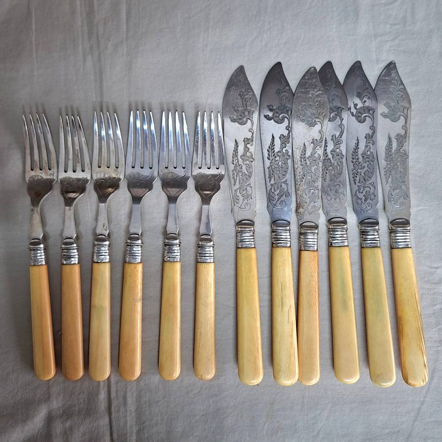 12 Fish knives and forks Silver hallmarked collars - bone or ivorine handles - etched