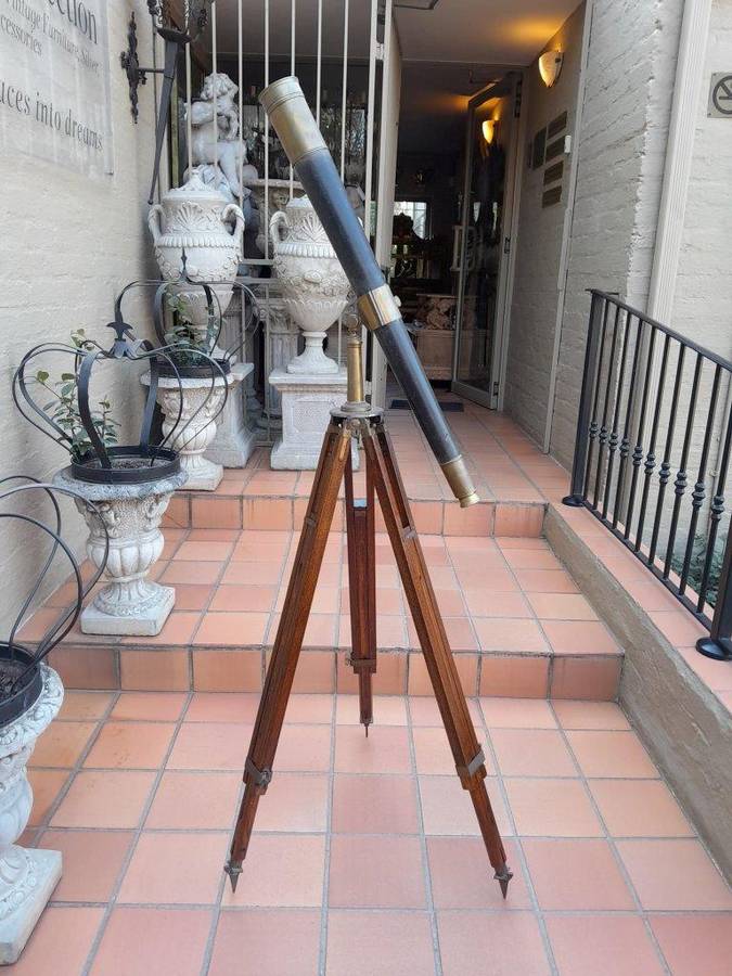 An Antique Brass And Leather Telescope On Brass And Oak Tripod Stand