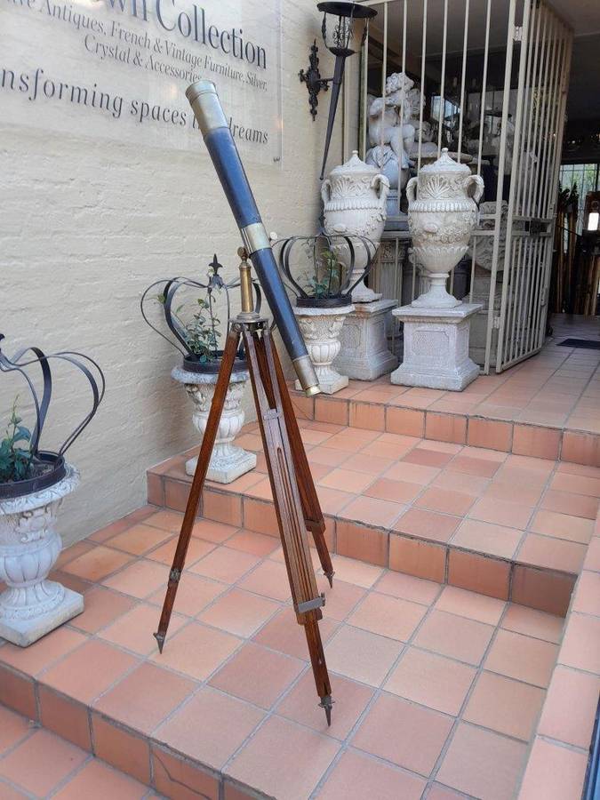 An Antique Brass And Leather Telescope On Brass And Oak Tripod Stand