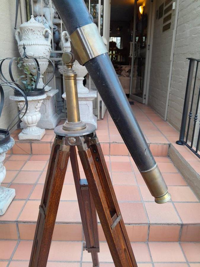 An Antique Brass And Leather Telescope On Brass And Oak Tripod Stand