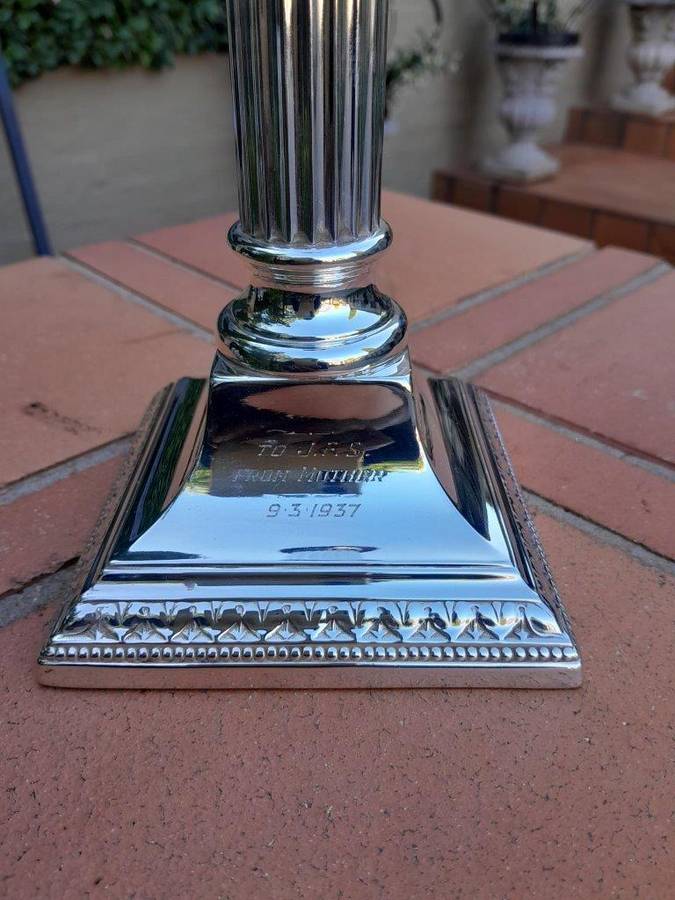 A Pair Of Silver-Plated Column Candlesticks