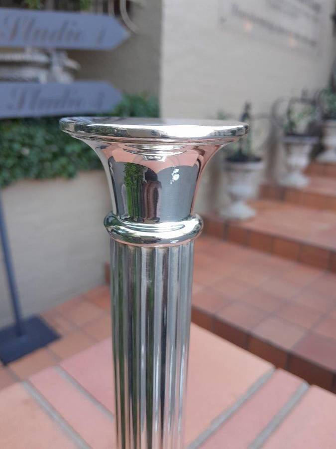 A Pair Of Silver-Plated Column Candlesticks