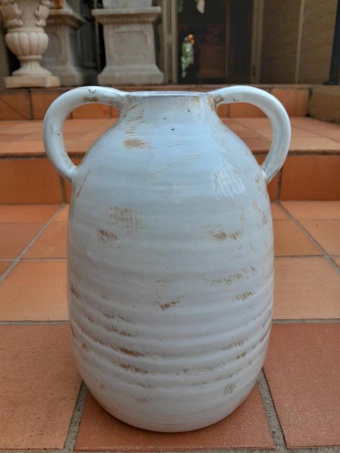 A Pair Of Ceramic Urns With Two Handles