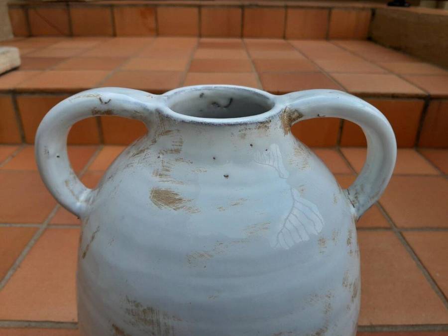 A Pair Of Ceramic Urns With Two Handles