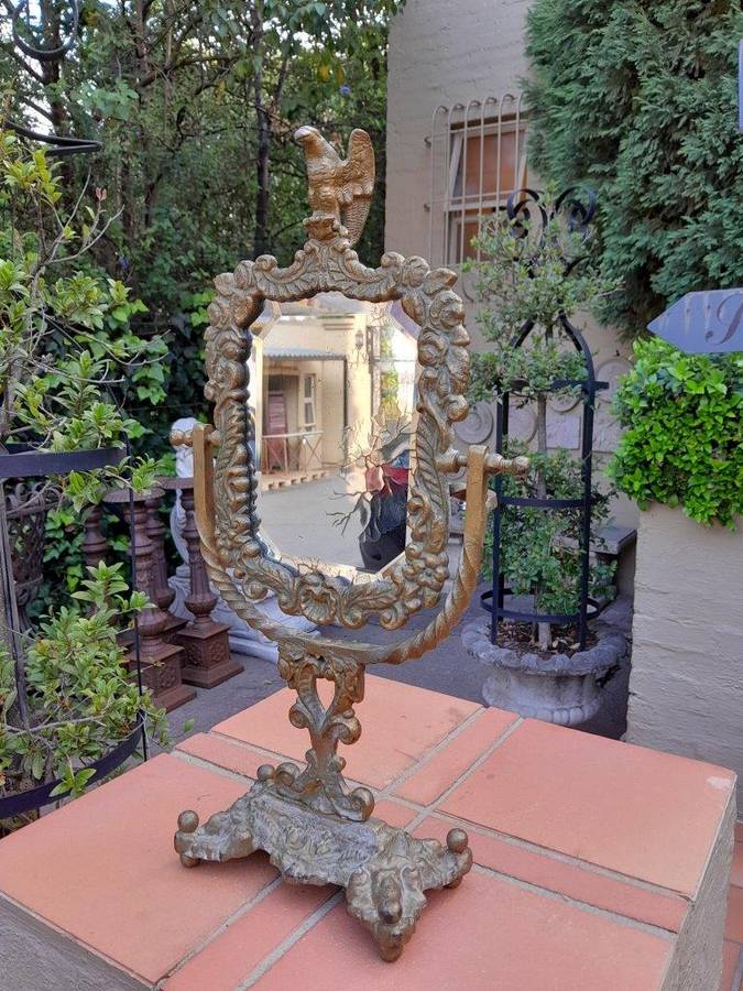 A Victorian Style Brass Bevelled Table Aged Mirror  In An Antique Gold Paint Finish