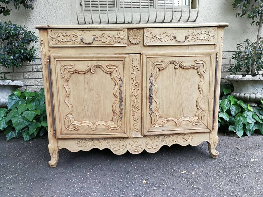 A Provincial Style French Oak Server in a Contemporary Bleached / Natural Wood Finish with Cream ...