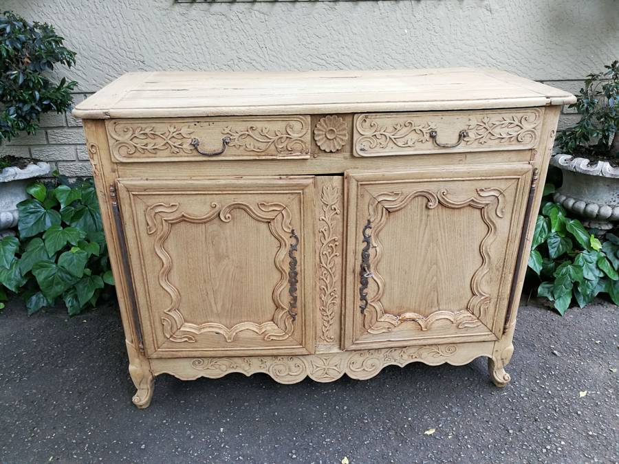 A Provincial Style French Oak Server in a Contemporary Bleached / Natural Wood Finish with Cream ...