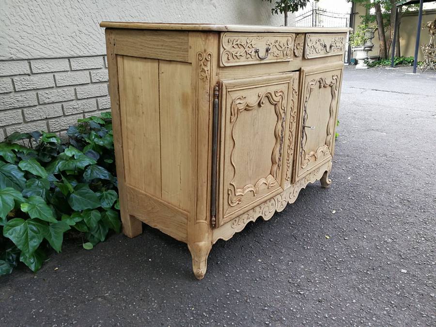 A Provincial Style French Oak Server in a Contemporary Bleached / Natural Wood Finish with Cream ...