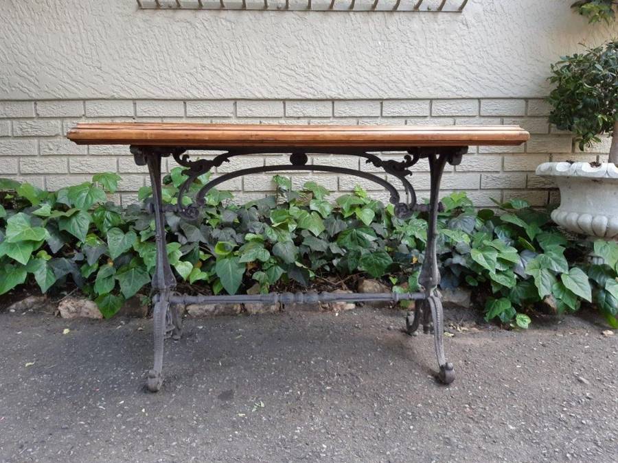A Victorian Cast-Iron And Pine Table