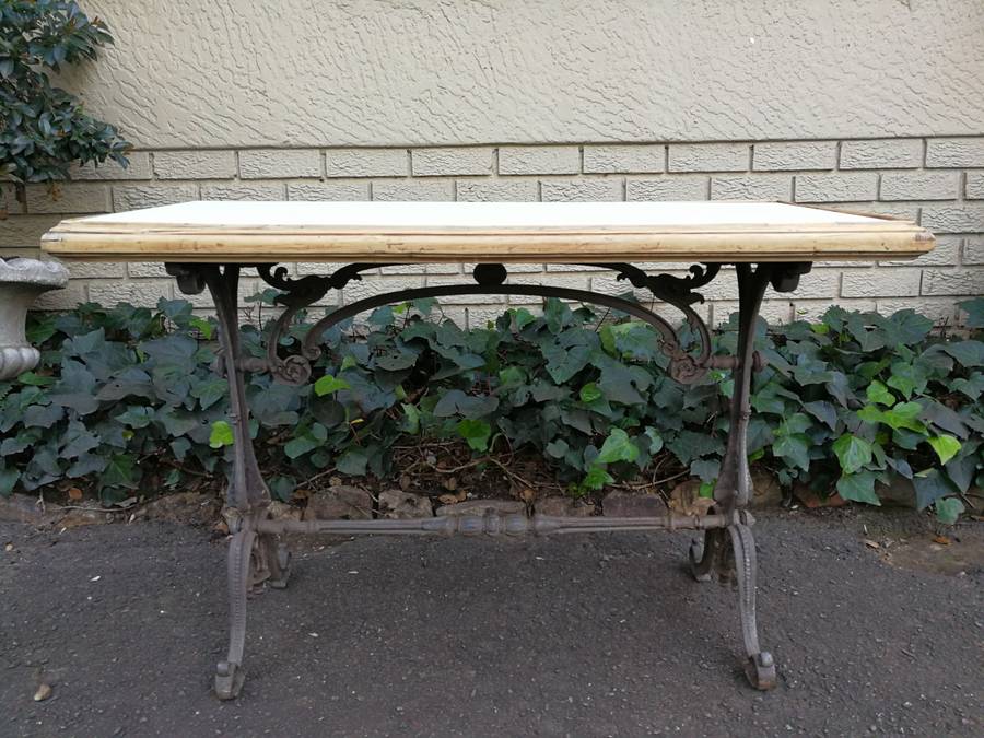 An Antique Victorian Cast Iron Table with a Marble Top with A  Bleached Wooden Surround