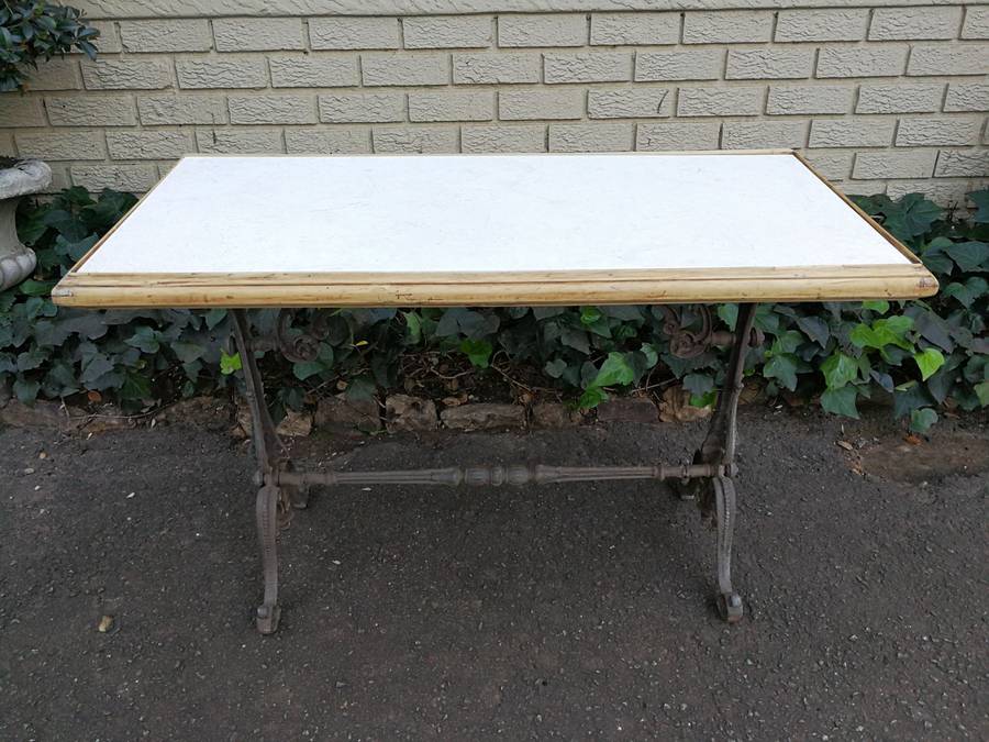An Antique Victorian Cast Iron Table with a Marble Top with A  Bleached Wooden Surround