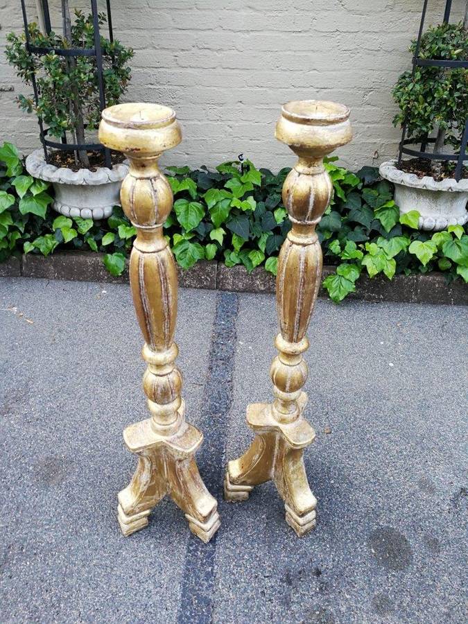A Pair Of Carved Wooden Candle Holders Hand Gilded With Gold Leaf