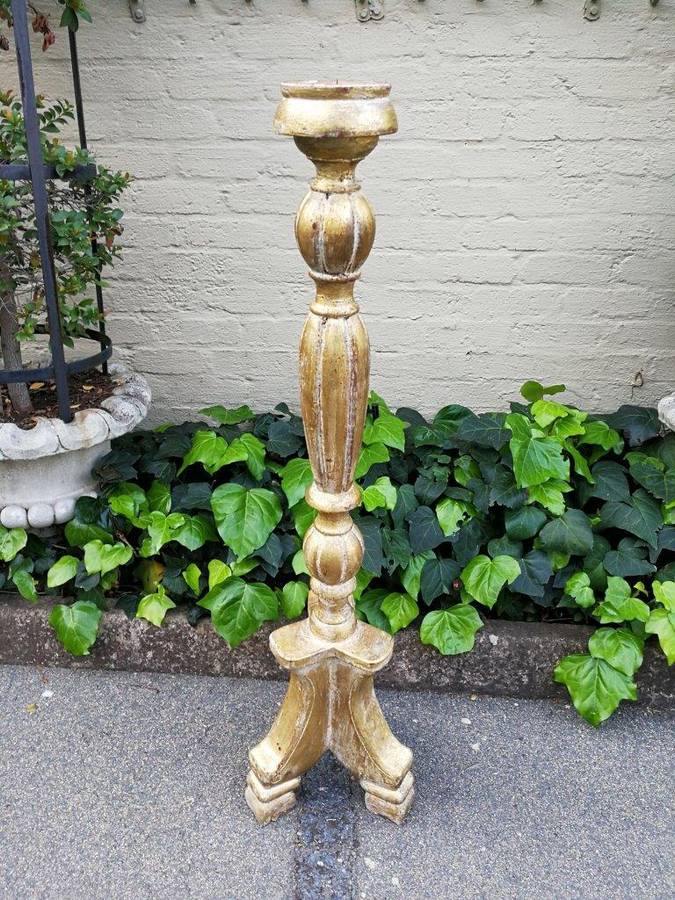 A Pair Of Carved Wooden Candle Holders Hand Gilded With Gold Leaf
