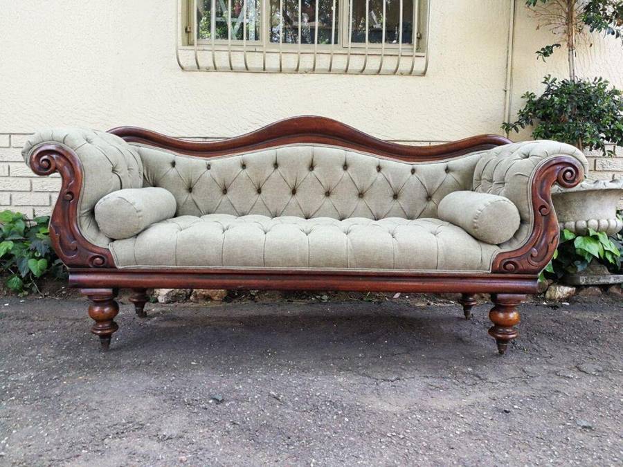 An Antique Victorian Carved Rosewood Settee on Castors Unholstered in French Linen with Bolsters ...