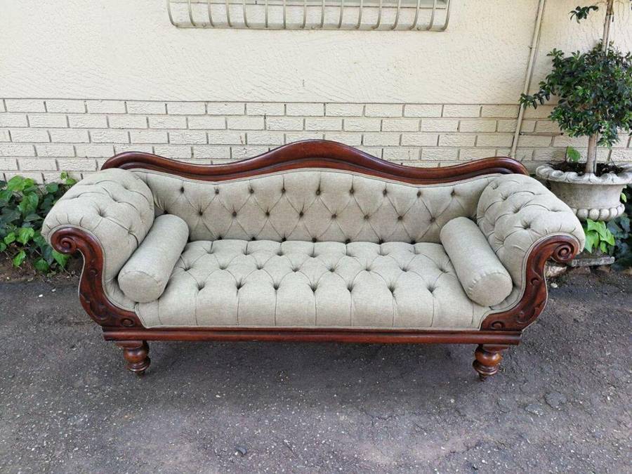 An Antique Victorian Carved Rosewood Settee on Castors Unholstered in French Linen with Bolsters ...