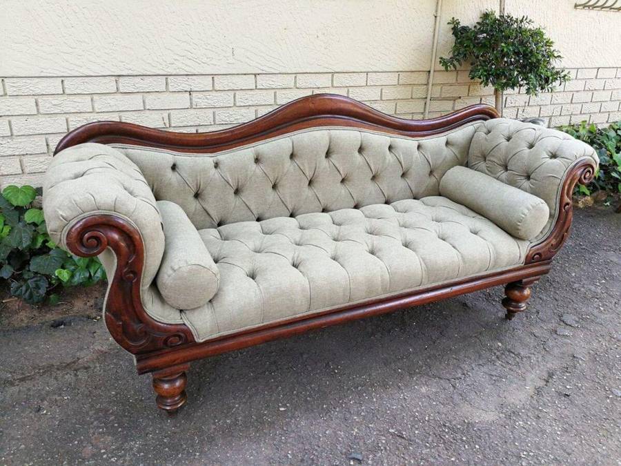 An Antique Victorian Carved Rosewood Settee on Castors Unholstered in French Linen with Bolsters ...