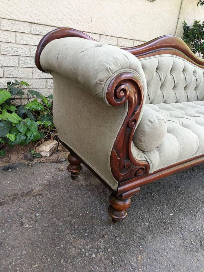 An Antique Victorian Carved Rosewood Settee on Castors Unholstered in French Linen with Bolsters ...
