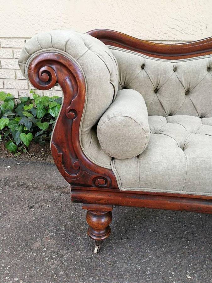 An Antique Victorian Carved Rosewood Settee on Castors Unholstered in French Linen with Bolsters ...