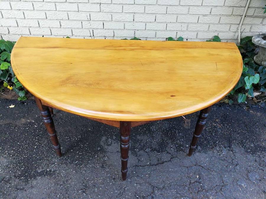 A 19th Century Pair Of Cape Yellowwood And Stinkwood Demi-Lune Tables