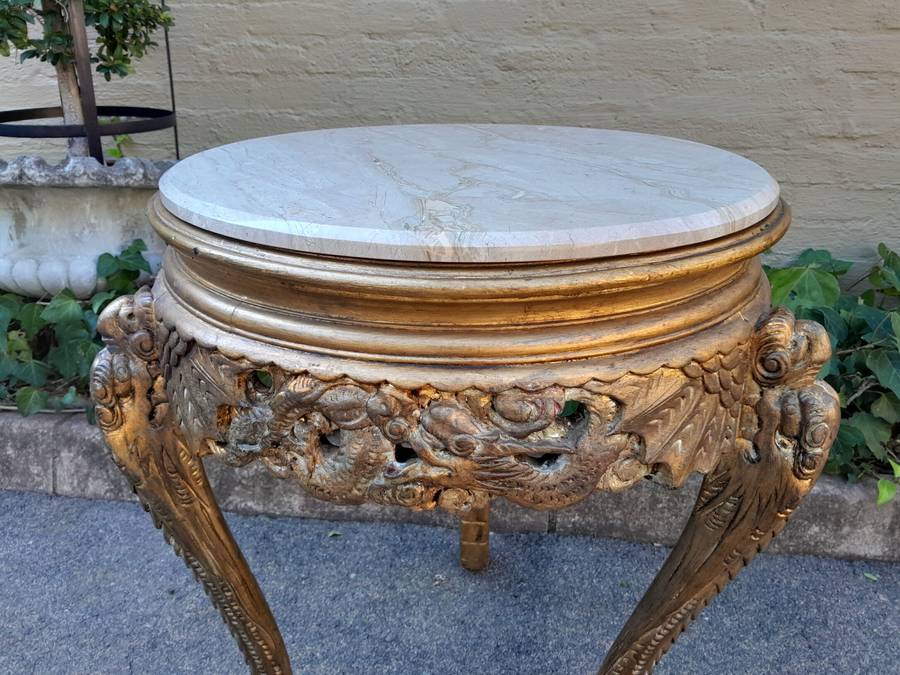 An Early 20th Century Carved and hand-gilded with gold leaf table with Marble Top