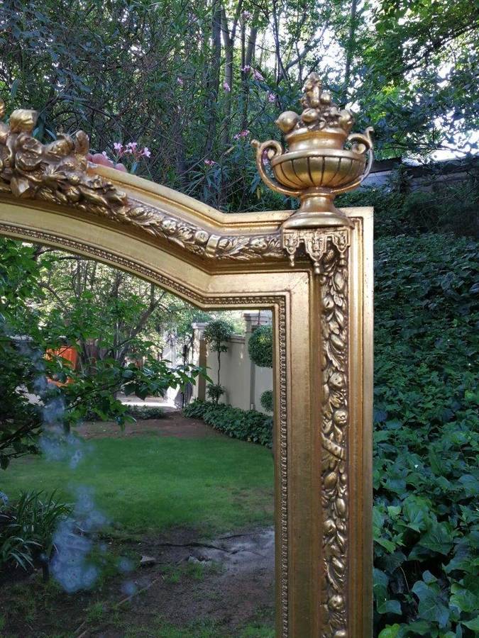 A Continental Carved Giltwood Mirror