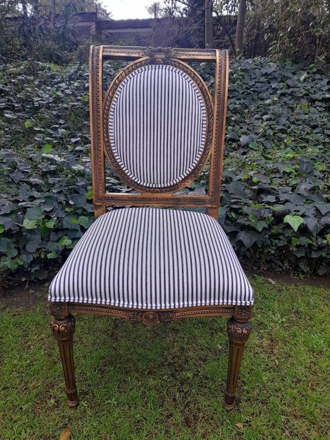 A Pair of French Style Hand-Gilded Chairs