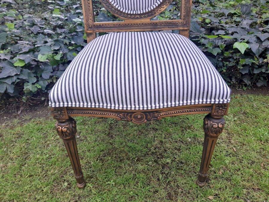 A Pair of French Style Hand-Gilded Chairs