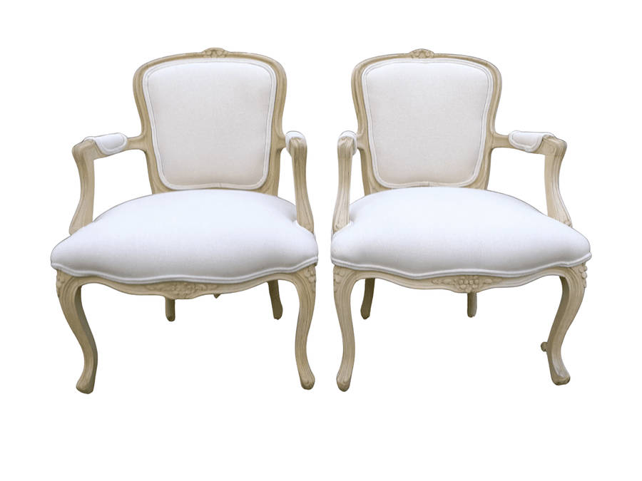A Pair of 20th Century French Rococo Style Oak Armchairs in a bleached / natural finish
