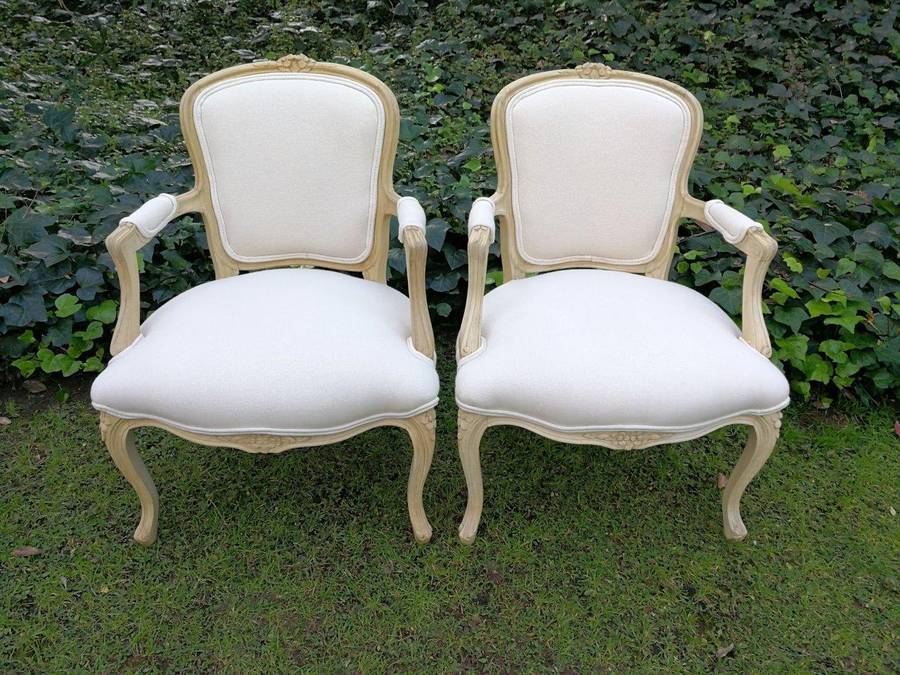 A Pair of 20th Century French Rococo Style Oak Armchairs in a bleached / natural finish