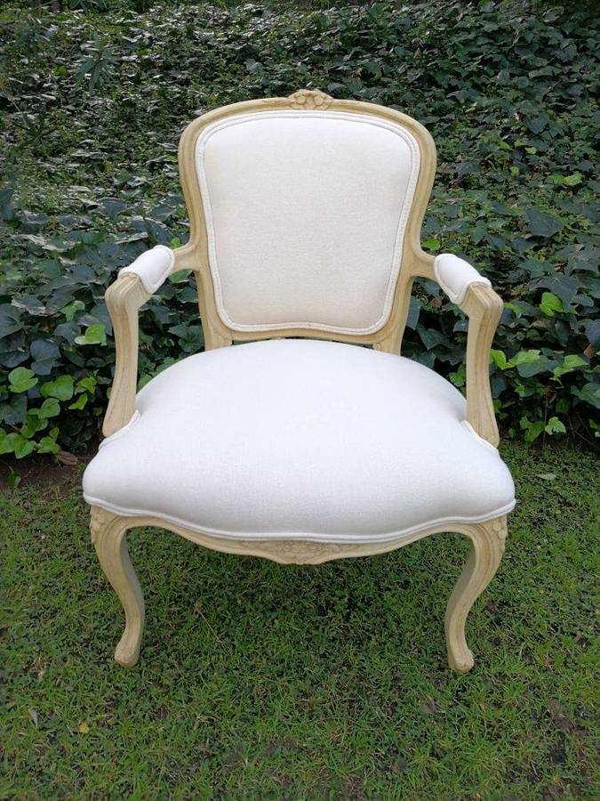 A Pair of 20th Century French Rococo Style Oak Armchairs in a bleached / natural finish