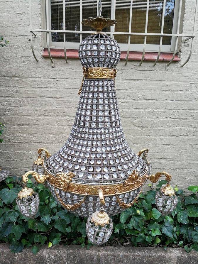 A French Empire Style Brass and Gilt Chandelier