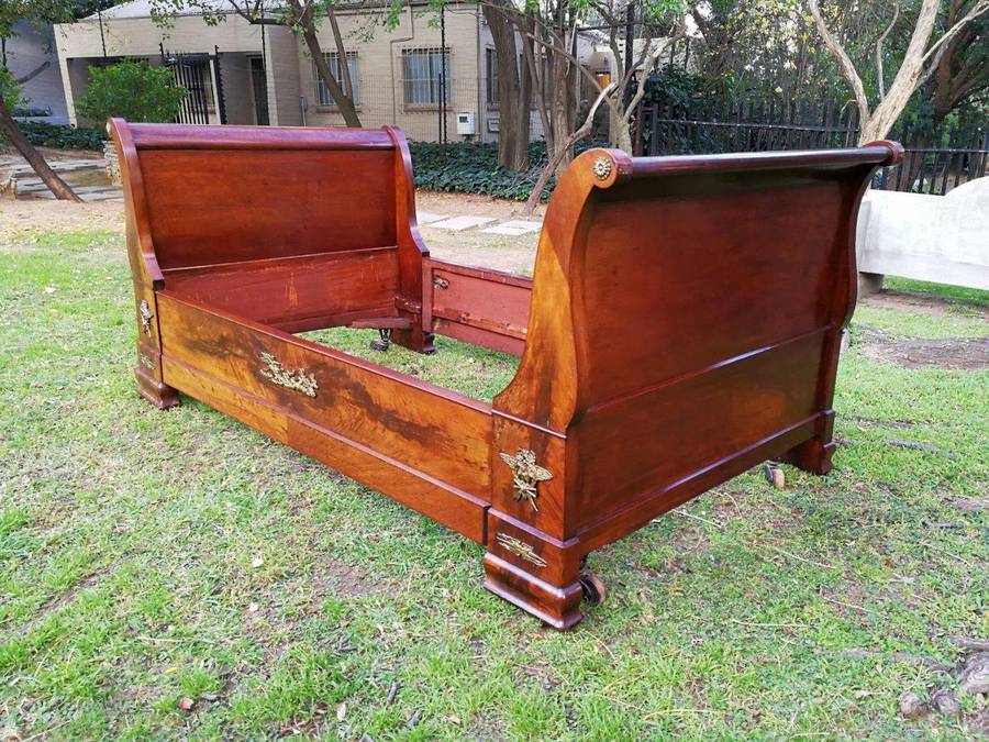 An Early 20th Century French Mahogany Lit Bateau Daybed/Bed With Gilt-Brass And Castors