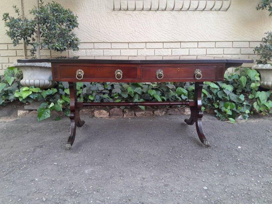 A Victorian Circa 1870, Mahogany Drop-side Library Table, With Drawers and Brass Escurcheons (the...