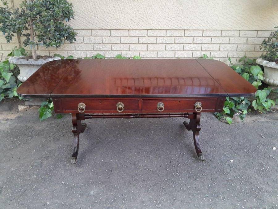 A Victorian Circa 1870, Mahogany Drop-side Library Table, With Drawers and Brass Escurcheons (the...