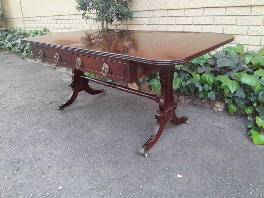 A Victorian Circa 1870, Mahogany Drop-side Library Table, With Drawers and Brass Escurcheons (the...
