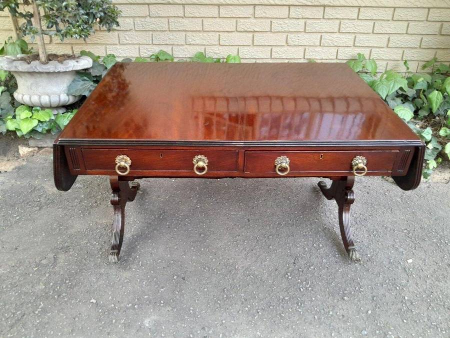 A Victorian Circa 1870, Mahogany Drop-side Library Table, With Drawers and Brass Escurcheons (the...