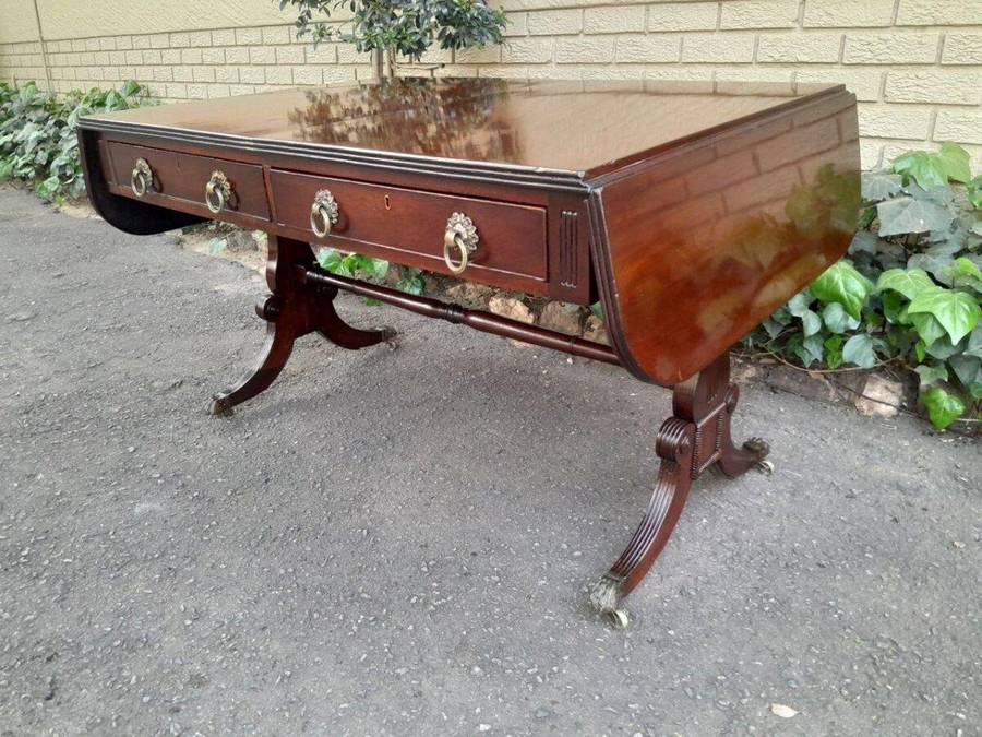 A Victorian Circa 1870, Mahogany Drop-side Library Table, With Drawers and Brass Escurcheons (the...