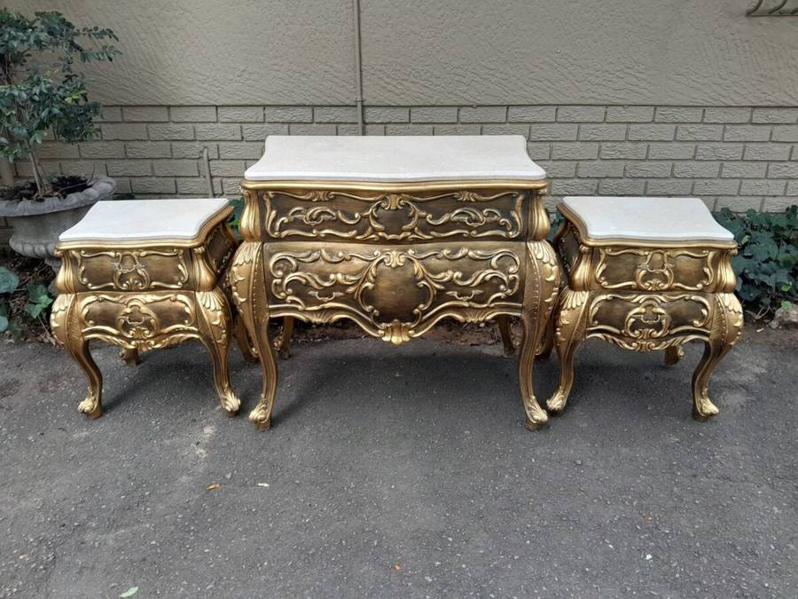 A Set of French Rococo Style Ornately Carved and Gilded Chest of Drawers and Pair of Side Tables ...
