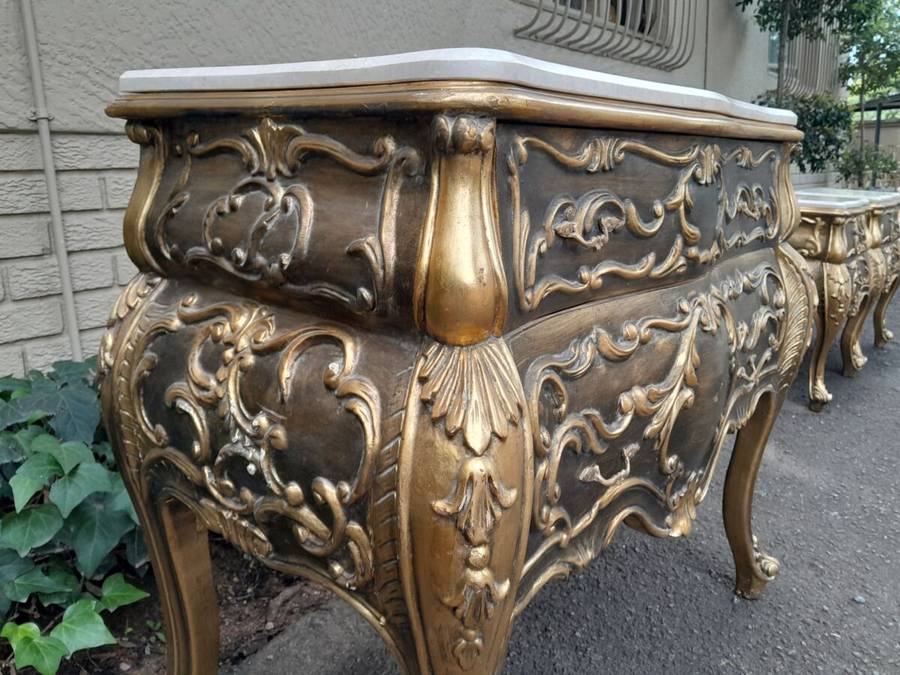 A Set of French Rococo Style Ornately Carved and Gilded Chest of Drawers and Pair of Side Tables ...