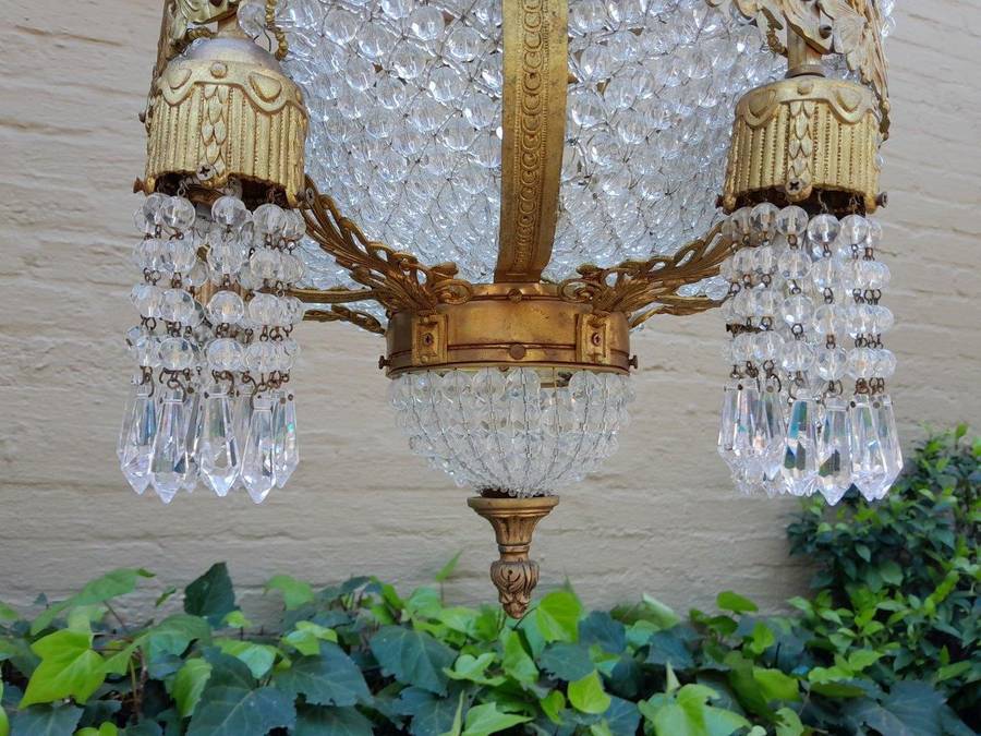 A 20th Century French Style Brass & Aged Crystal Chandelier