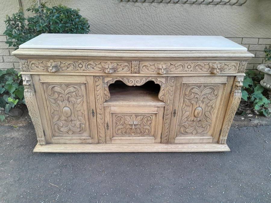 An Early 20th Century Heavily Carved Oak Sideboard / Buffet / Drinks Table With Two Drawers And T...