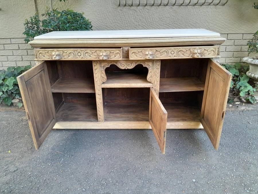An Early 20th Century Heavily Carved Oak Sideboard / Buffet / Drinks Table With Two Drawers And T...