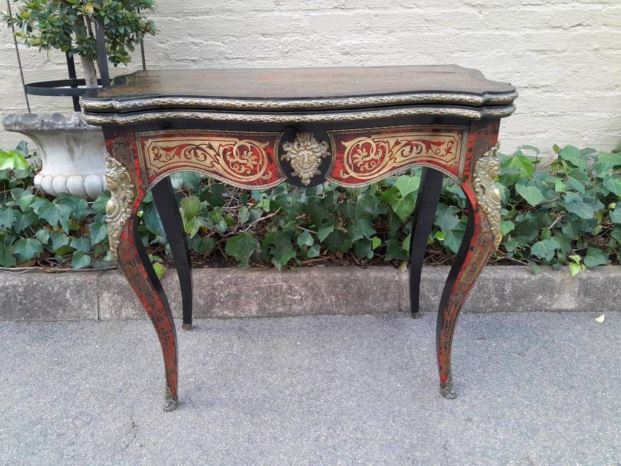 A 19th Century Boulle, Ebonised and Ormolu Mounted Cart Table