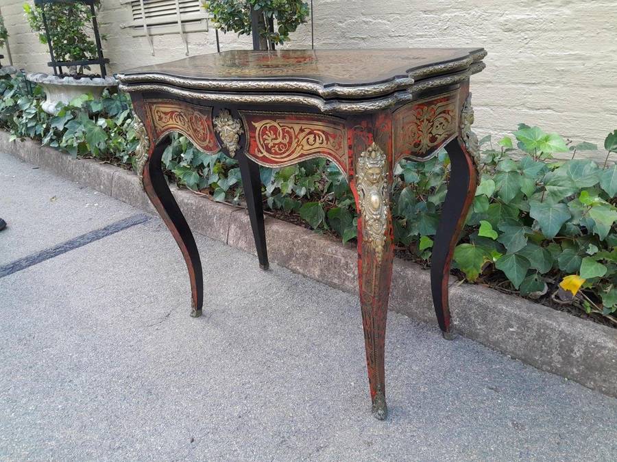 A 19th Century Boulle, Ebonised and Ormolu Mounted Cart Table