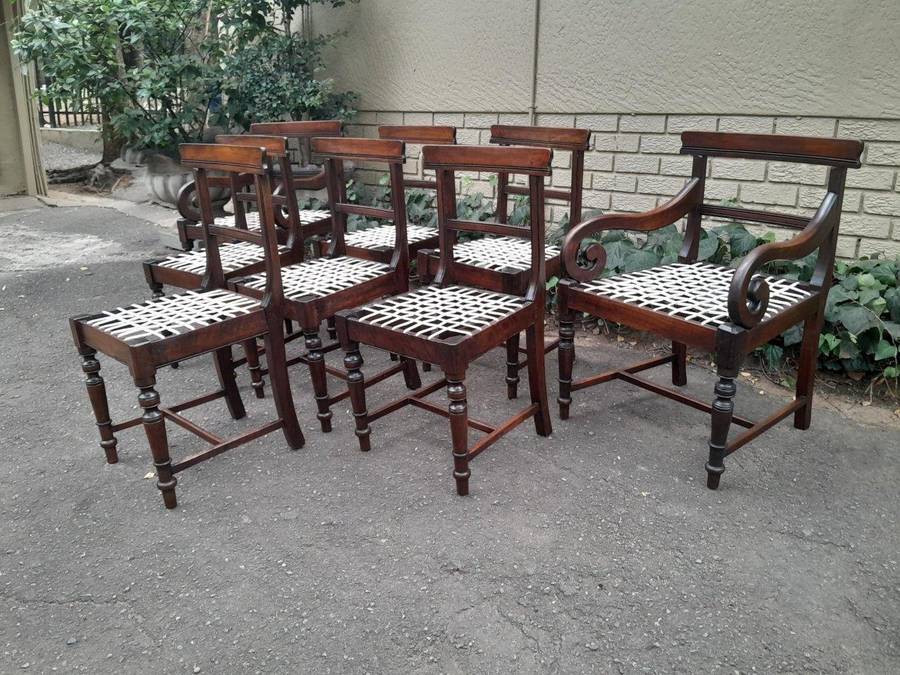 A 19th Century Set of Eight Cape Stinkwood Dining Charis with Riempie Seat Comprising Two Carvers...