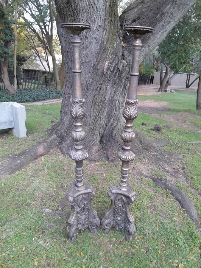 A Pair of French Style Carved and Gilded Floor or Table Candle Holders