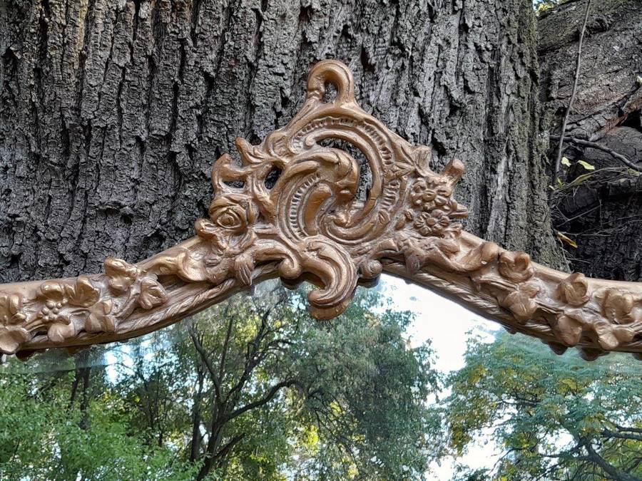 A French Style Ornately Carved and Gilded Bevelled Mirror of Large Proportions
